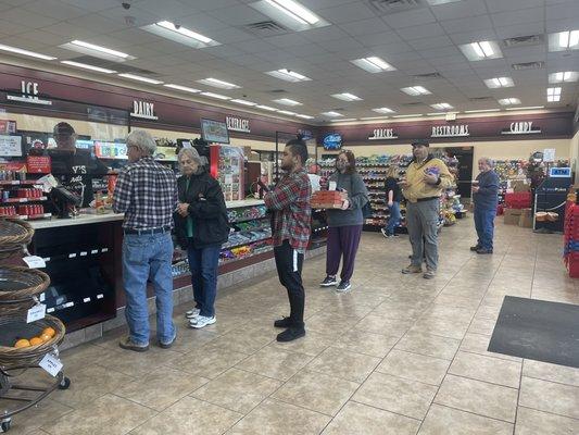 Six people waiting impatiently in line, with just one cashier. Where was the manager and why wasn't she staffing a cash register?