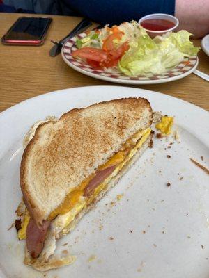 Side salad and egg sandwich with ham