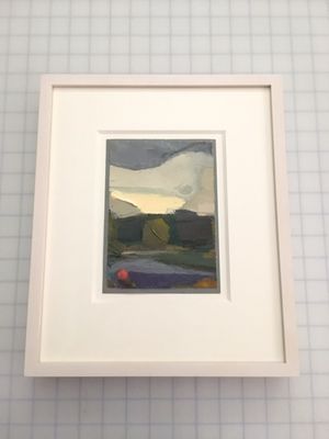 A small oil painting framed in a white washed maple frame.