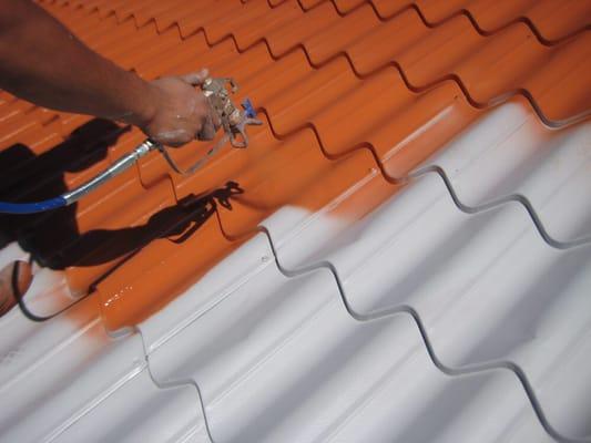 Painting a metal tile roof with NXT Cool Coat heat reflective paint.