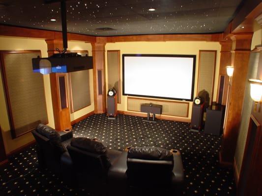 Our showroom's demonstration theater features an 11-channel Dolby Atmos speaker system and 100-inch projection screen.