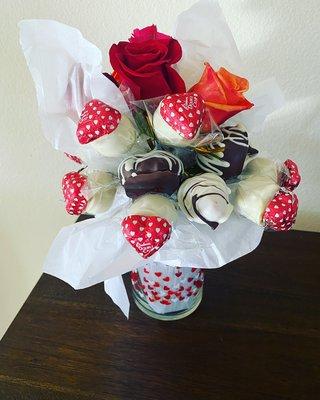 Chocolate cover strawberries and flowers bouquet