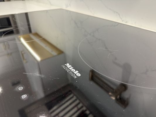 Deep scratch in brand new Miele induction top