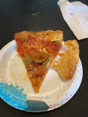 Pizza on crust that is crunchier and drier than a cracker