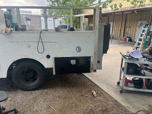 Repair of tool box after blowout on freeway.