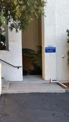 Stairs leading down to the main entrance via back parking lot.