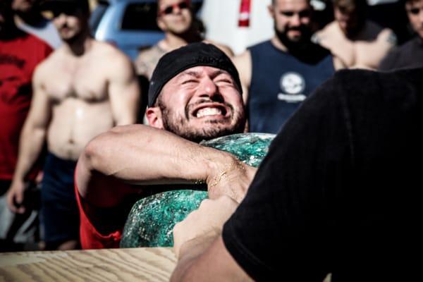 Tony Nella lifting the stones in the Strongman tournament