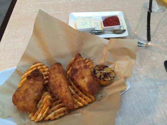 Fish and chips with roasted lemon