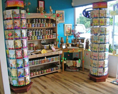 We sell Pet Odor and Smoke Odor Exterminator candles of various scents and novelty Blue Mountain Arts cards in English and Spanish.