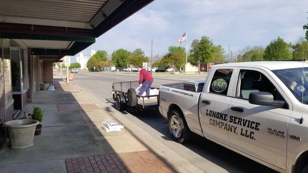 Helping with putting out flowers with Lonoke Beautification Team  for Community  service in our area