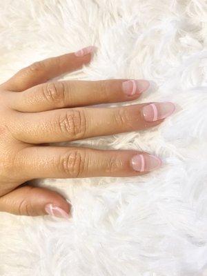 Almond shape, acrylic nails with a pink shellac French mani.