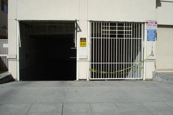 Broken garage doors. Homeless and criminals can just walk in and access the entire building.