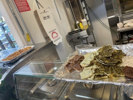 Samples!!  Left to right. Fried pita, meat pie, cheese pie, zaatar pie, falafel