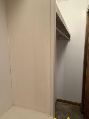 Painted one portion of the closet and left the long strip unpainted.