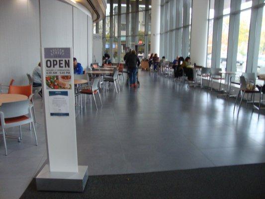 Looking south in the lobby, towards the cafe - sign & seating area.