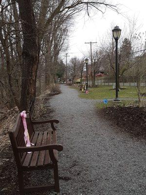 Cute little pinwheels flank the walking path on the right and beribbboned park benches are scattered throughout.