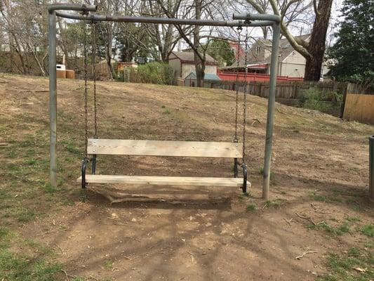 Rocking swing, tennis/hockey courts behind