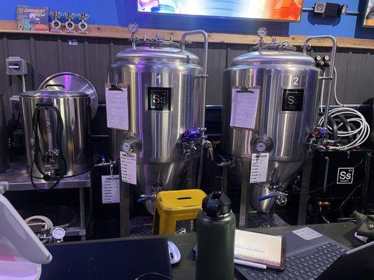 Fermentation tanks behind the bar.