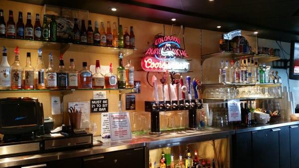 The Avs logo behind the bar.