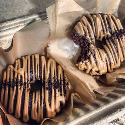 Two spectacular chocolate latte doughnuts.