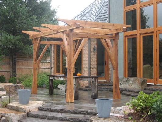 Timber Frame Pergola and Home, both built by Envinity.