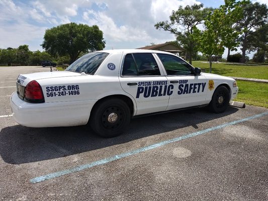 Marked patrol car with emergency lighting and internet connected computer.