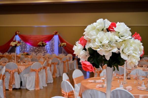 Our banquet hall accommodations set up for a wedding reception. Our rentals include tables and chairs.