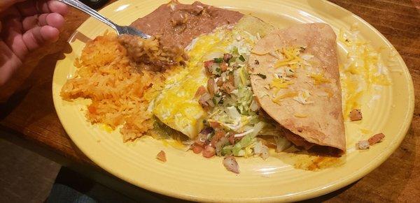 Crispy Shredded Beef Taco and a chicken enchilada with rice a beans