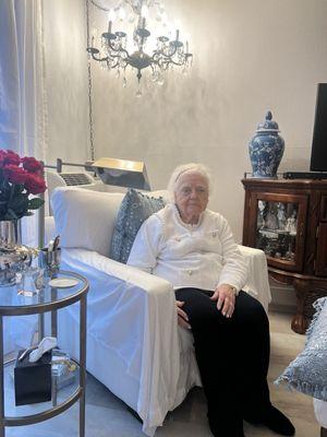 Mom in her room. Hardly time to sit in the chair:)