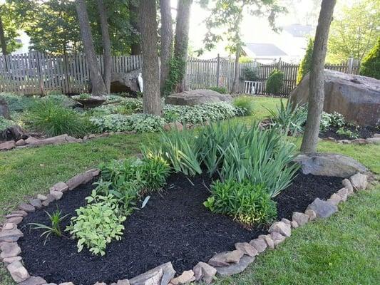 To further our vision for this property, SLC hauled rocks & mulch for the final touch.