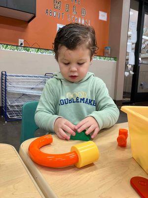 Having fun building in the toddler class!