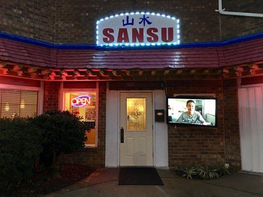 Located through a passageway in the very far corner of the Shopping Center is San Su restaurant. They have a TV hanging by the front door.