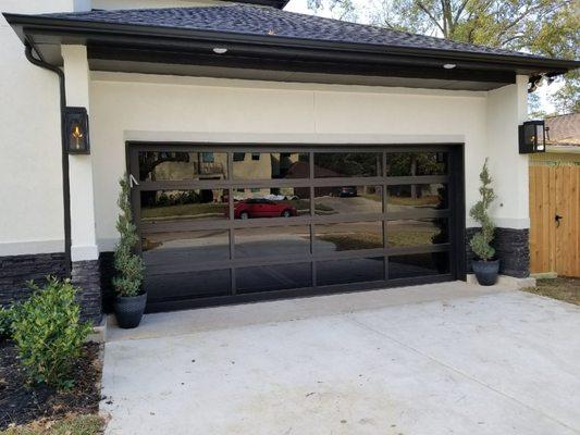 FULL VIEW DOOR WITH TINTED GLASS INSTALLED BY SENTRY GARAGE DOORS