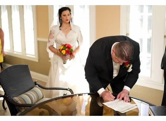 "Porch" in Bridal Suite signing the marriage certificate.