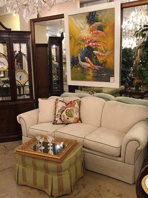 Koi oil painting above cream sofa w/ accent pillows