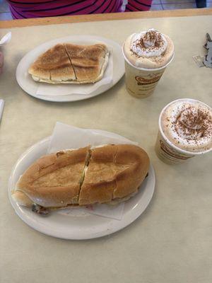 Buttered Toast and Cuban Sandwich with 2 Cappuccinos