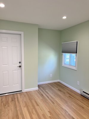 Newly built den with door leading to garage