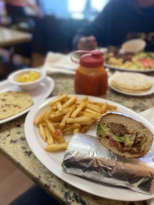 Steak torta with fries and Pupusas