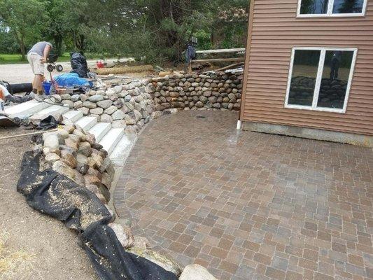 Boulder Retaining Wall with Brussels Brick Pavers and Drainage. Pinckney,Mi