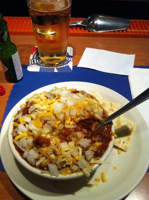 Chili with onions and cheese.