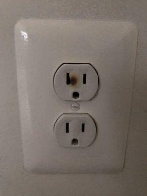 Outlet burnt after they replaced the outlet