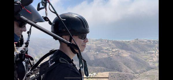 Happy customers paragliding in Malibu with Claude