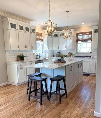 From dark cherry cabinets to a crisp white cabinetry with gold accents, this kitchen transformed into a gorgeous space!