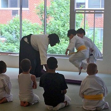 Sensei teaching the children's class about timing.