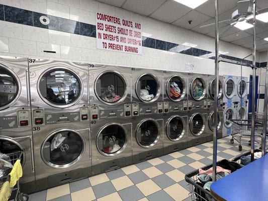 Workers Hogging the dryers for people who pay and leave their clothes here for the workers to do them.