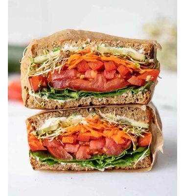 A veggie delight sandwich served on multigrain bread