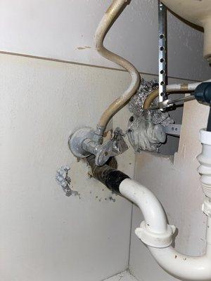 Bathroom sink under the cabinet  Aluminum foil and plastic wrap