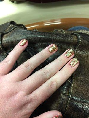 My solid gold with red sides nails when I wanted red base with some gold sparkles. Glitter on the side hasn't been cleaned up. Ugh!