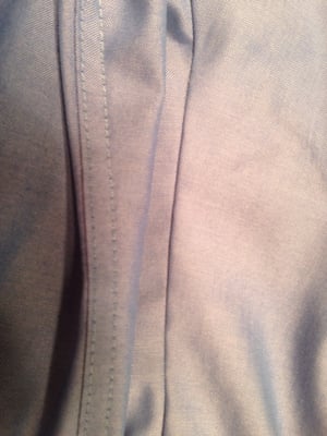 Hard to tell, but the stitching on the right is what another tailor did to my shirt, and to the left is the work of C-3.