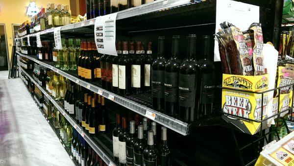 A wine isle in a gas station.